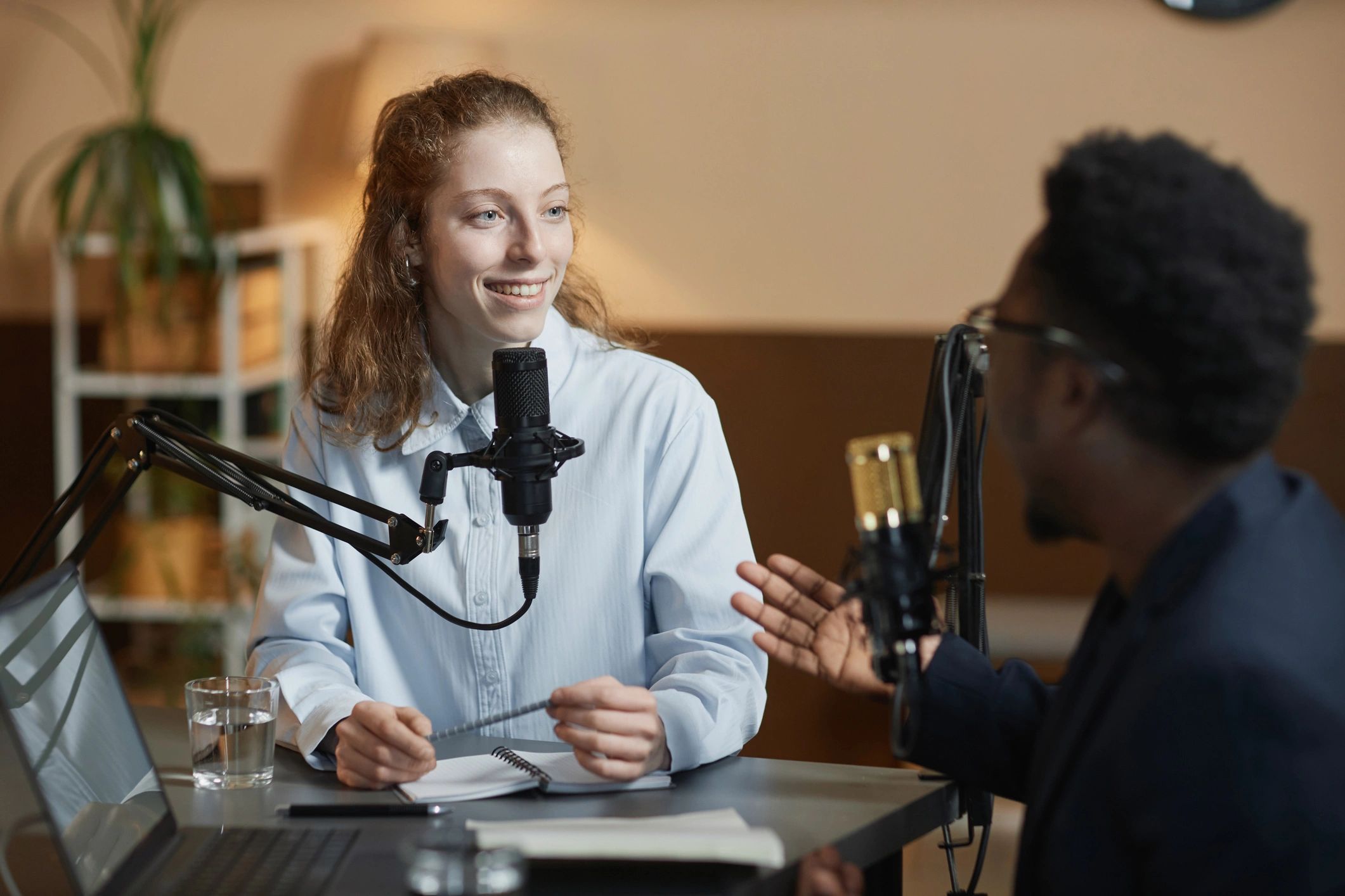 Podcast host listening during a studio recording session